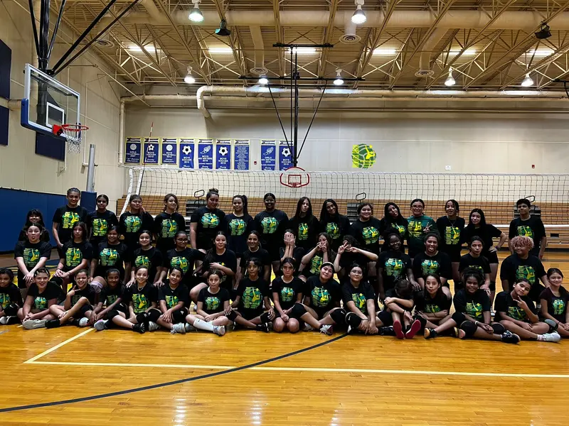 A large group of club players in a school gym