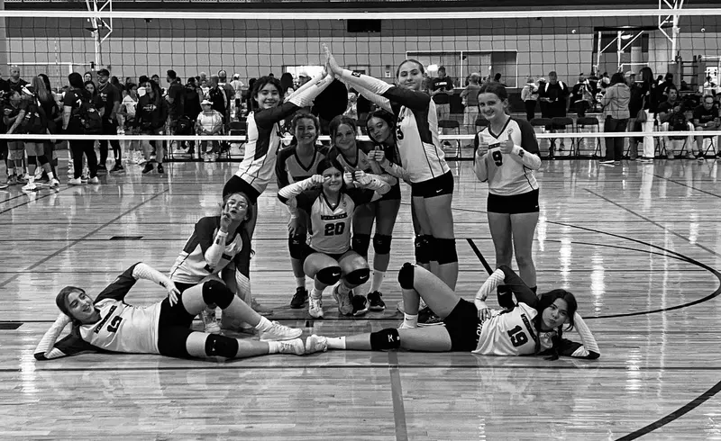 Players posing together on a tournament court